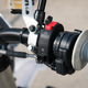 The aforementioned black “starter” button on a fully-electric motorcycle. The red switch is the kill switch.